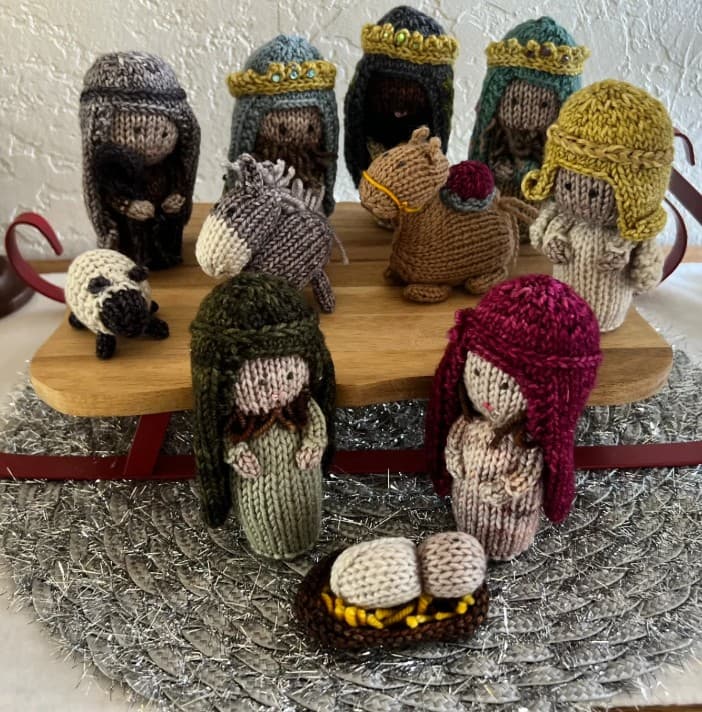 Hand-knit miniature nativity set with Mary, Joseph, and the Christ child
